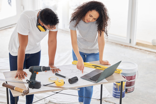 Image of couple looking at renovation plans