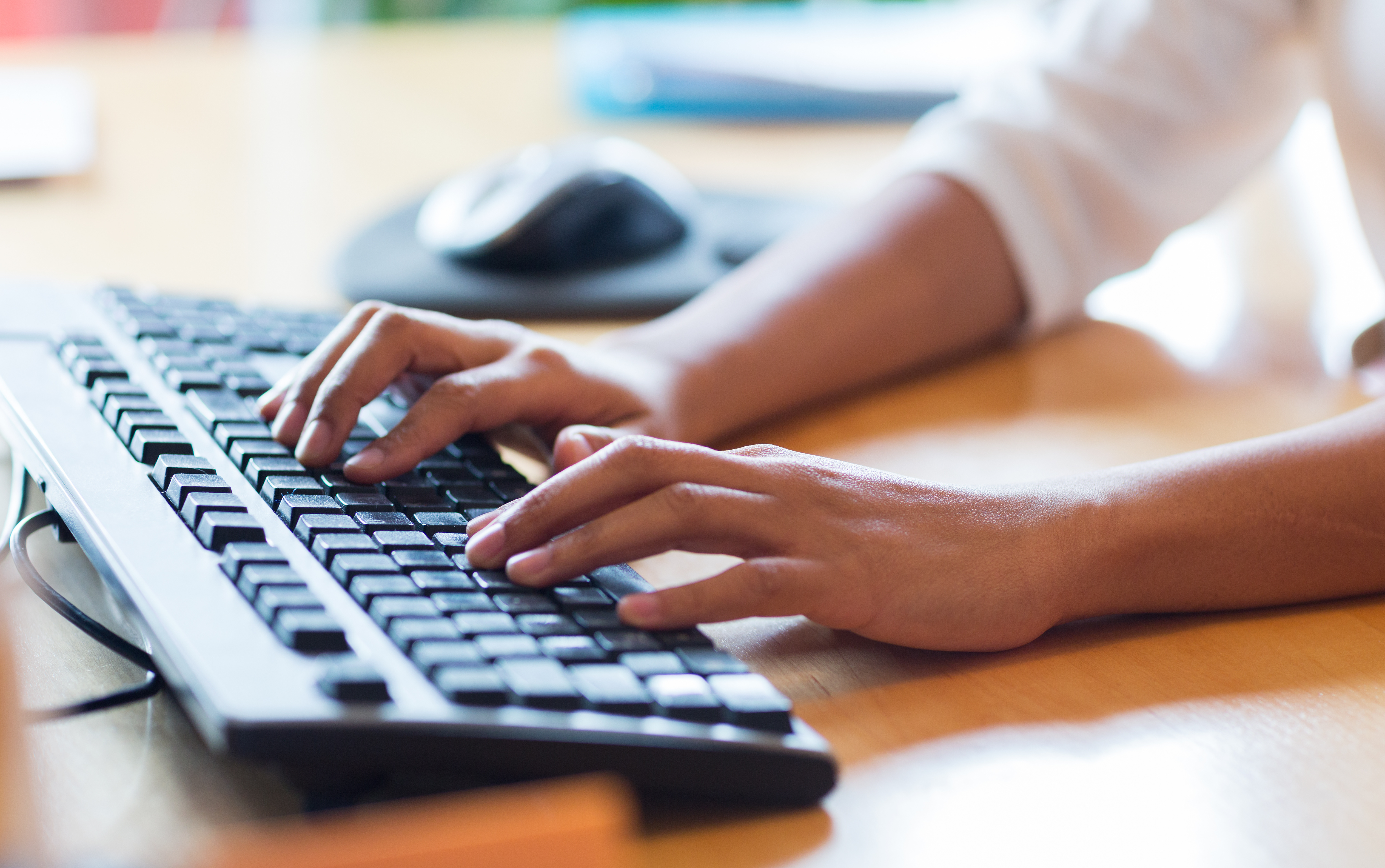 close up of woman's hand typing